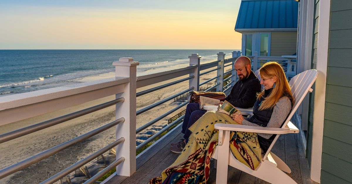 Family relaxing on porch at beach house in North Topsail Beach